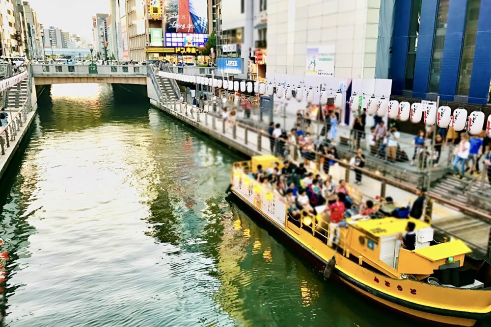 Tombori River Cruise boat and the Dotonbori Riverwalk