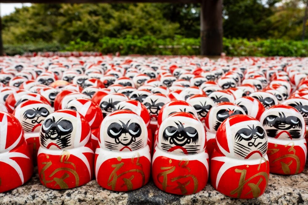 Rows of victory Daruma dolls at Katsuo-ji Temple